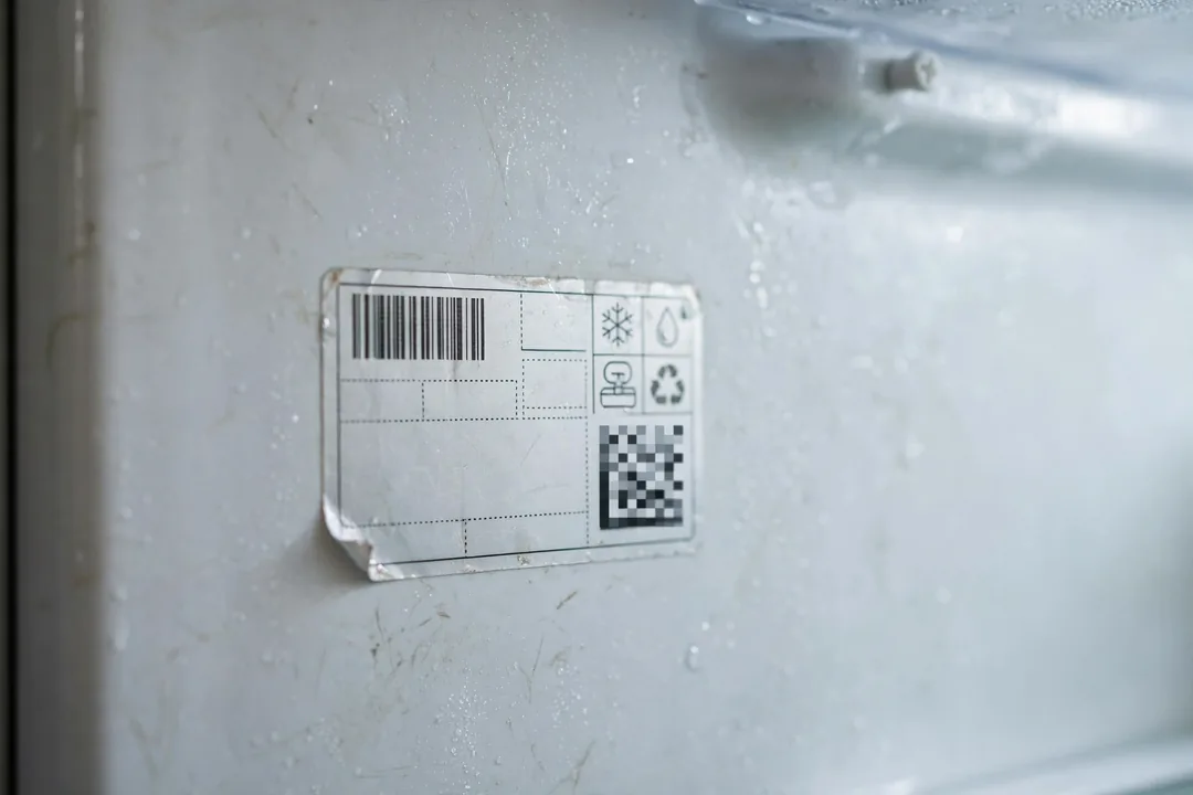 Close-up of a refrigerator model number tag showing where to find refrigerator model number